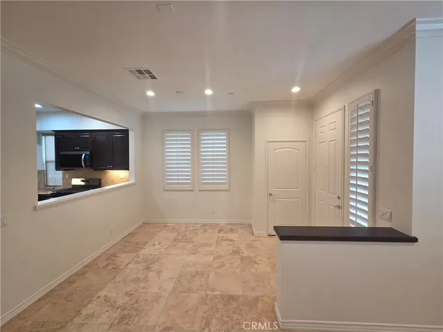 a view of an empty room and window