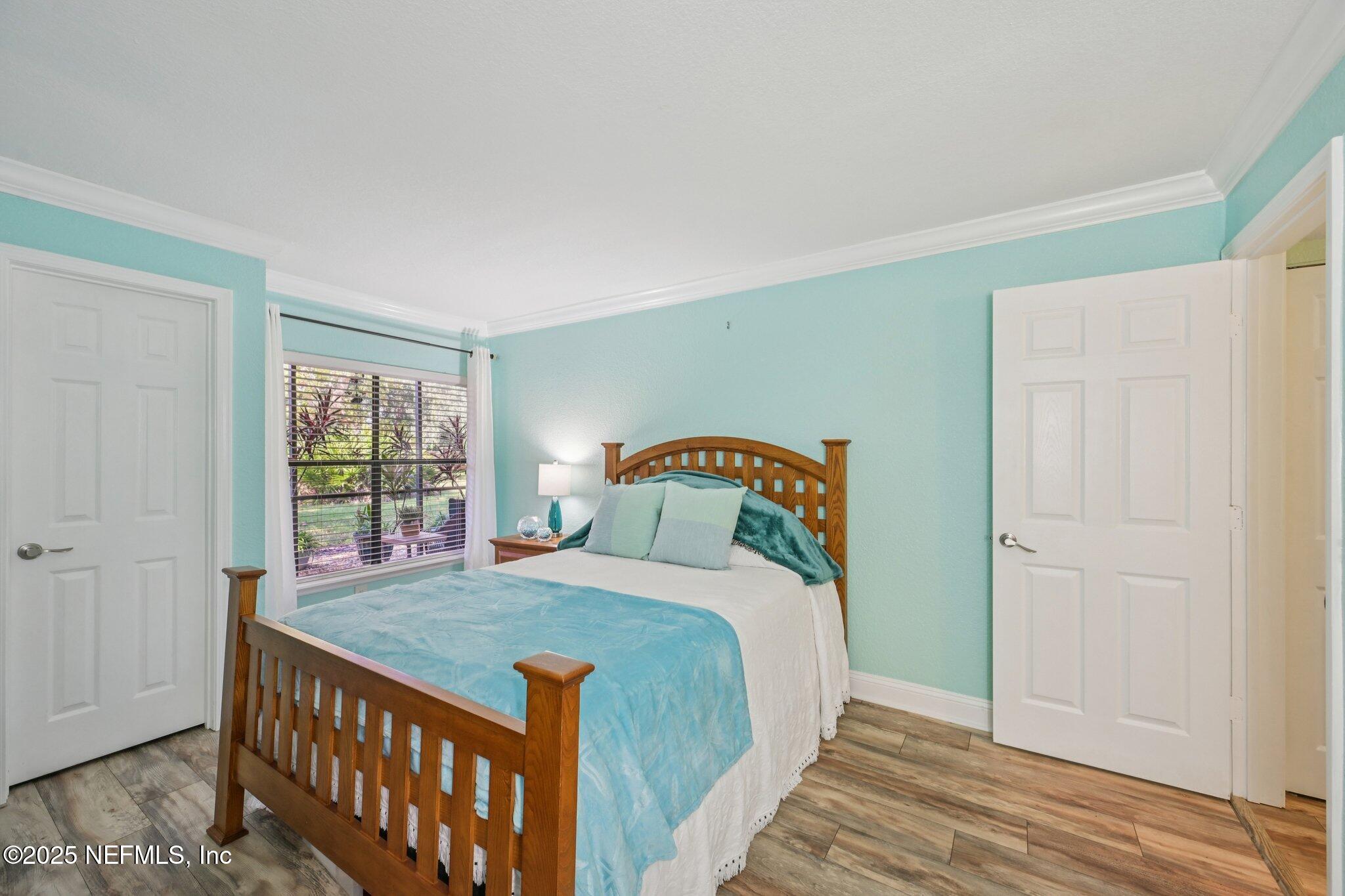 930 Seashell Lane Ponte Vedra Beach, FL 32082 - Photo 13 of 29 a bedroom with a bed and a window