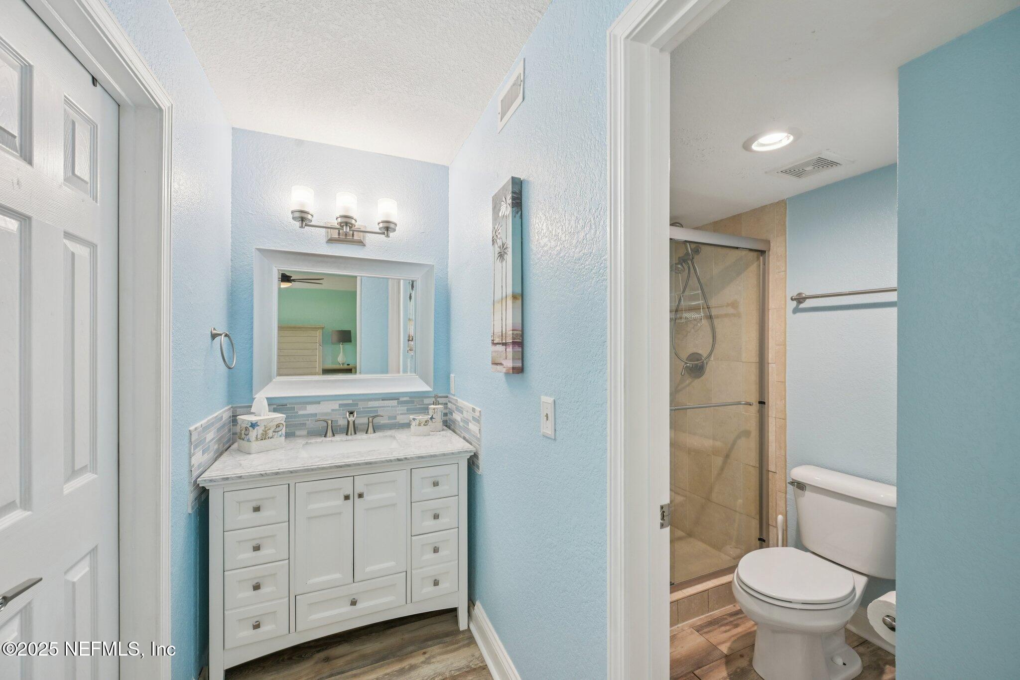 930 Seashell Lane Ponte Vedra Beach, FL 32082 - Photo 16 of 29 a spacious bathroom with a granite countertop sink toilet and shower