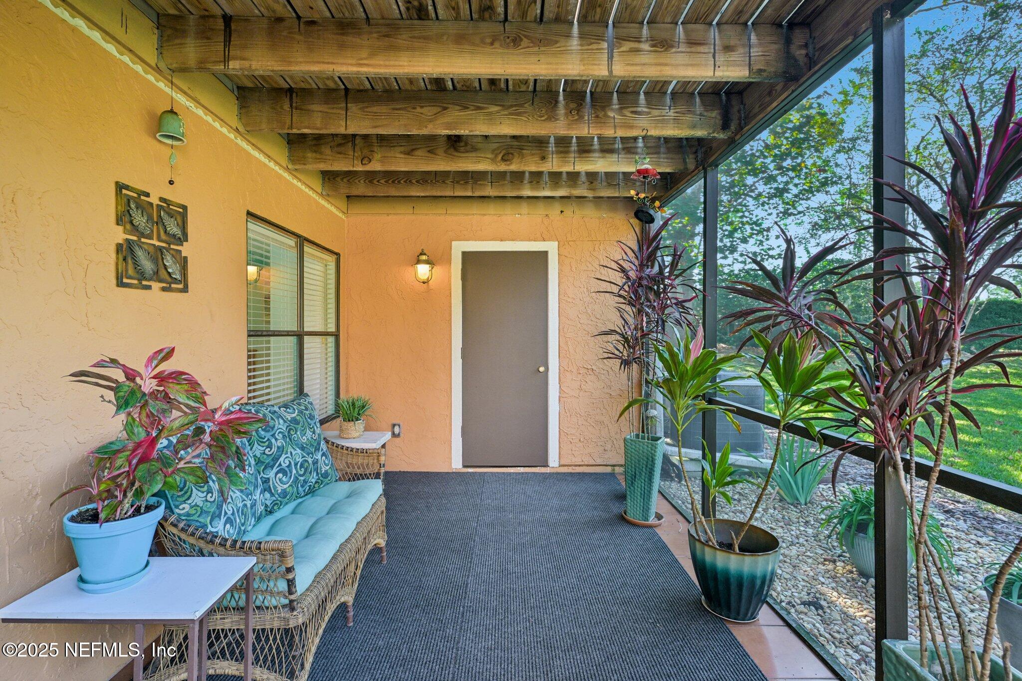 930 Seashell Lane Ponte Vedra Beach, FL 32082 - Photo 20 of 29 a house with potted plants in front of it