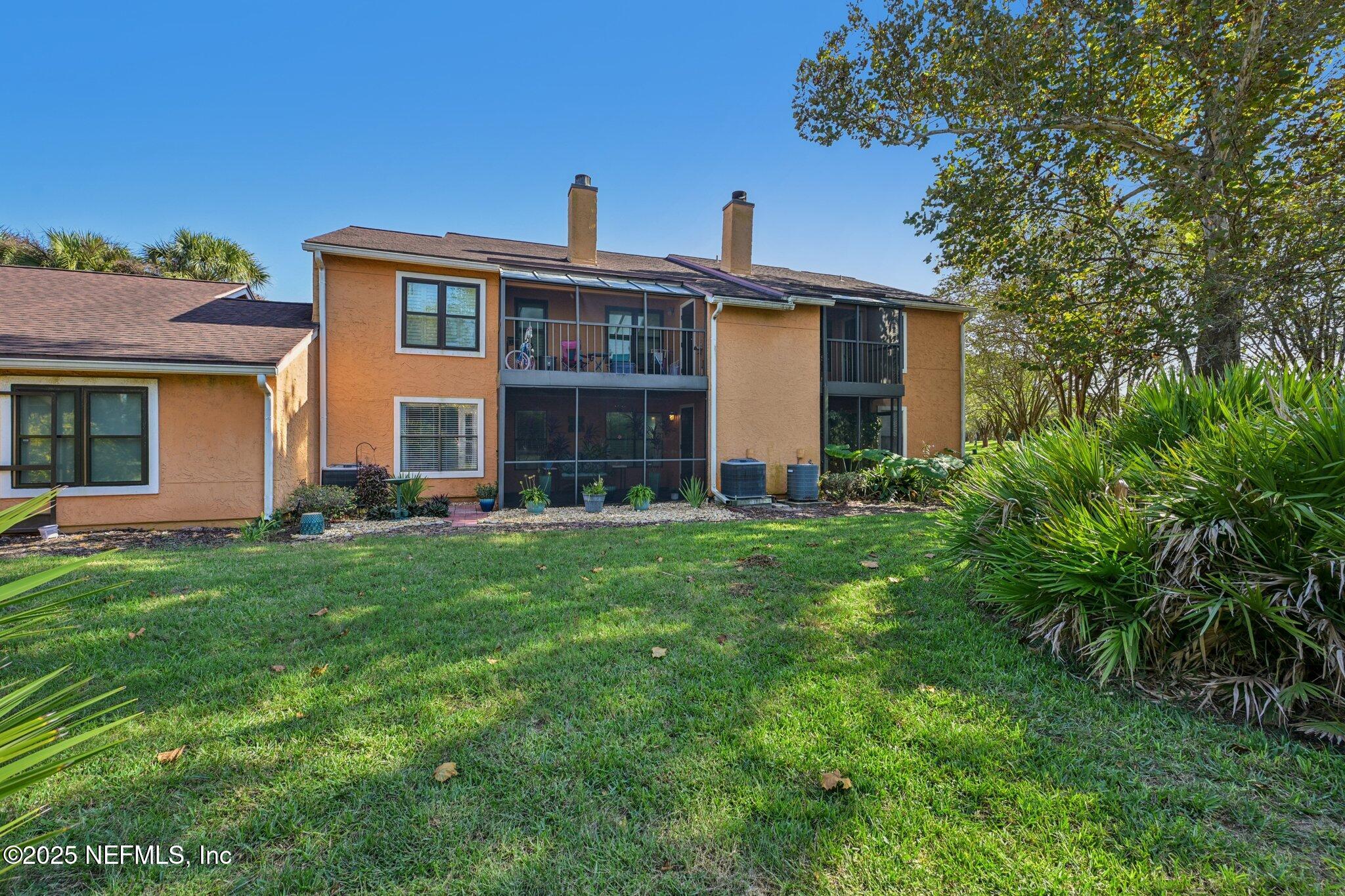 930 Seashell Lane Ponte Vedra Beach, FL 32082 - Photo 23 of 29 a front view of a house with a yard
