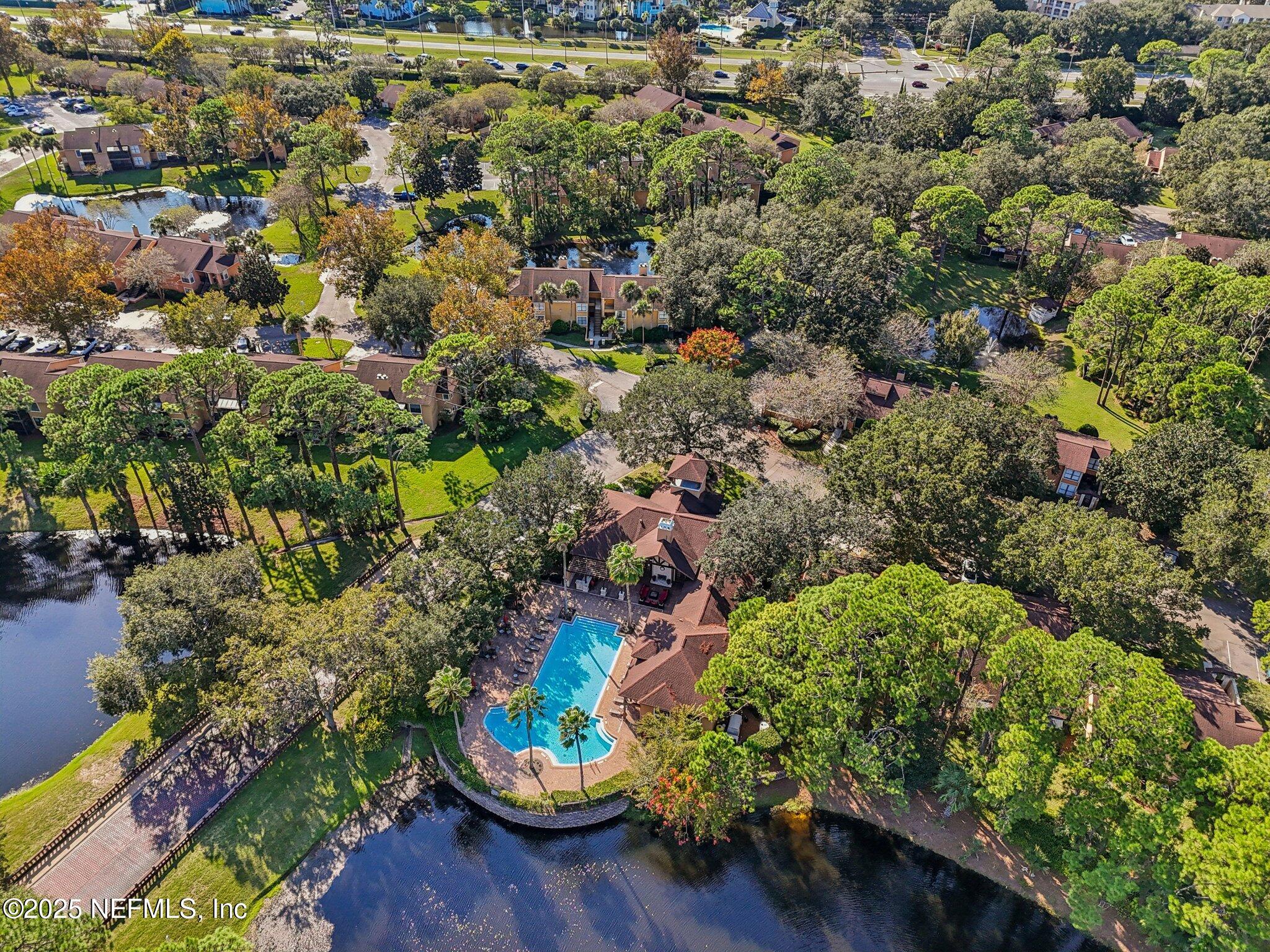 930 Seashell Lane Ponte Vedra Beach, FL 32082 - Photo 26 of 29 an aerial view of a house with a yard and lake view