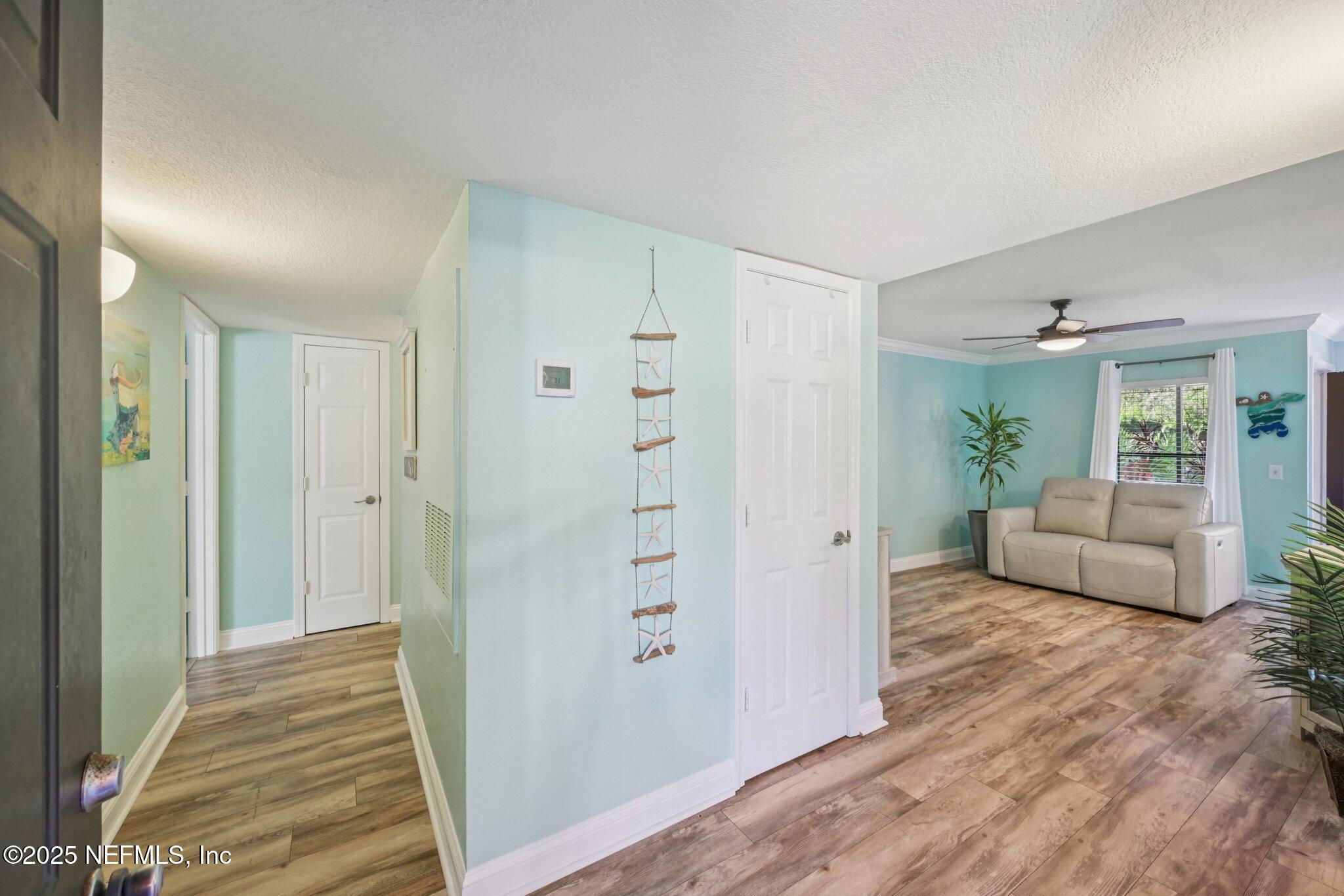930 Seashell Lane Ponte Vedra Beach, FL 32082 - Photo 4 of 29 a view of a livingroom with wooden floor and furniture