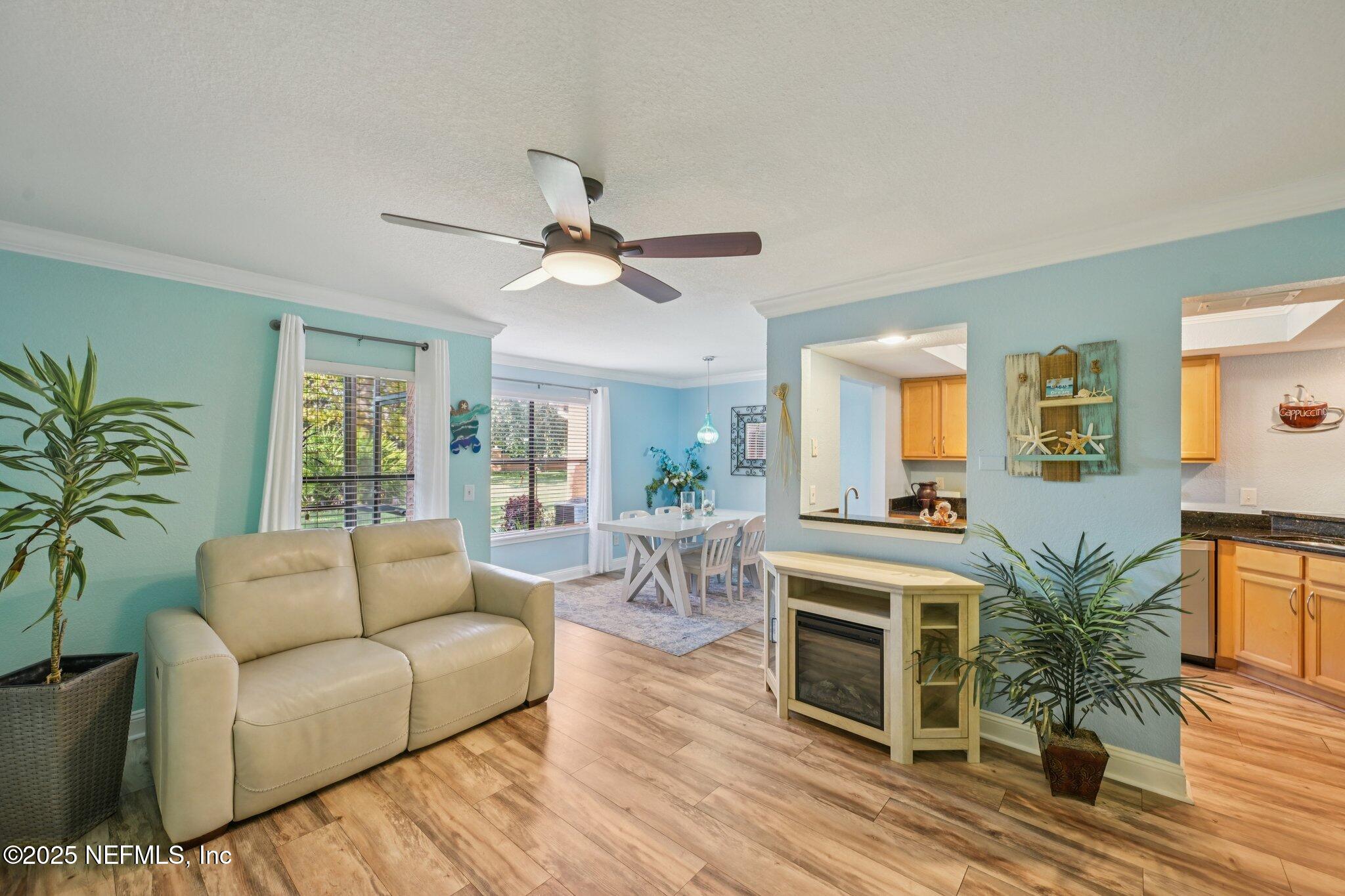 930 Seashell Lane Ponte Vedra Beach, FL 32082 - Photo 6 of 29 a living room with furniture and a fireplace