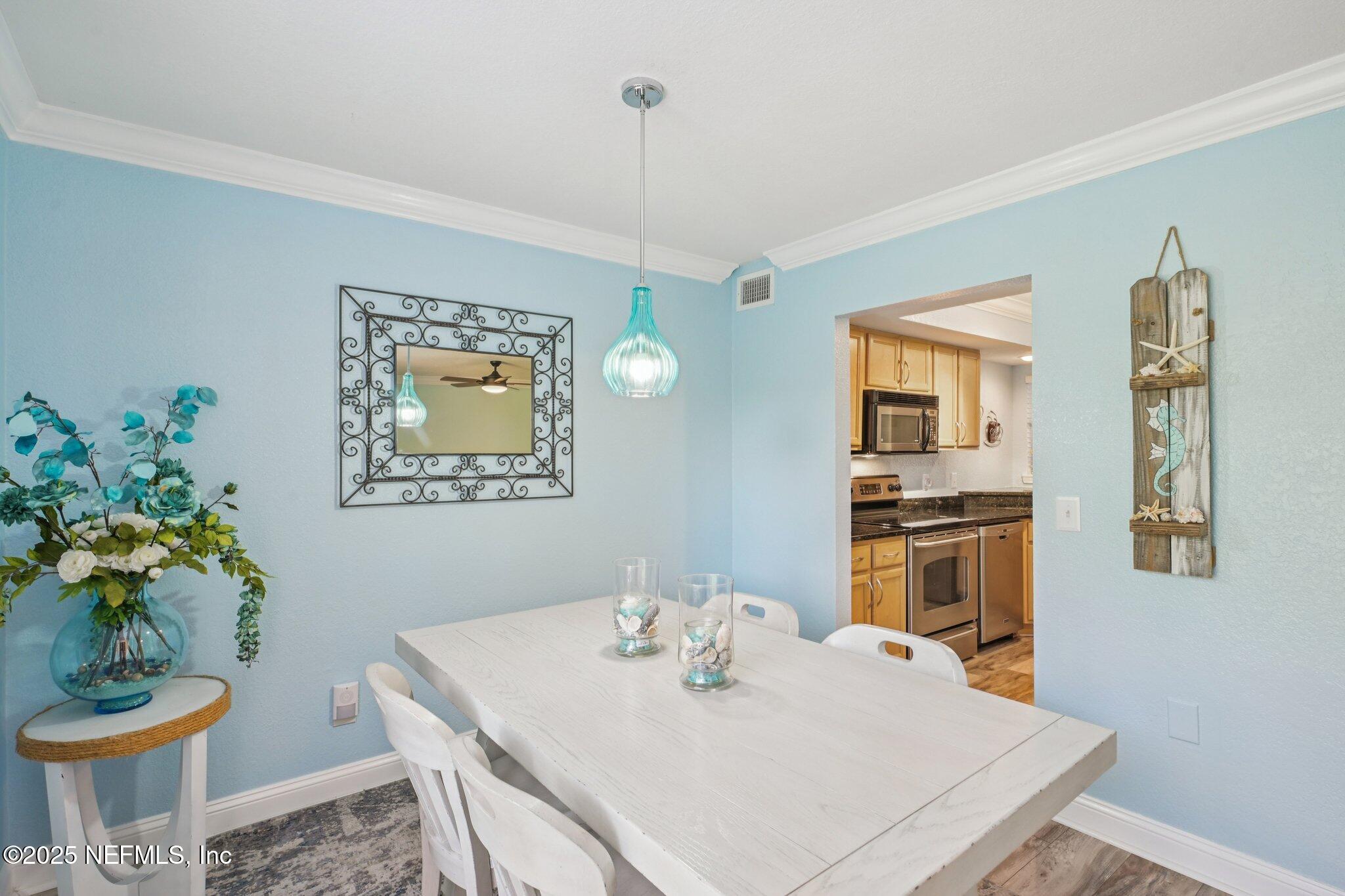 930 Seashell Lane Ponte Vedra Beach, FL 32082 - Photo 8 of 29 a view of a dining room with furniture window and wooden floor