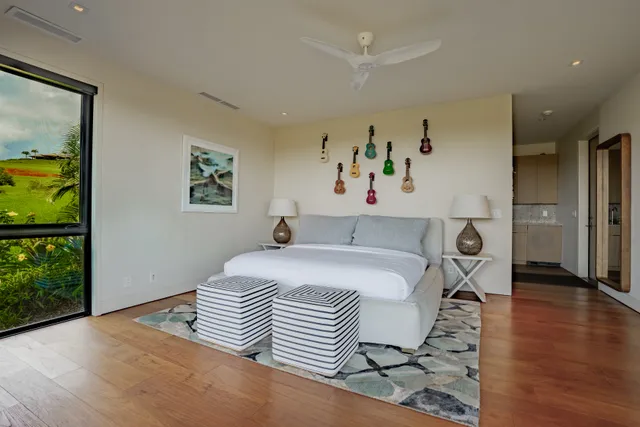 a bed room with a bed and glass door