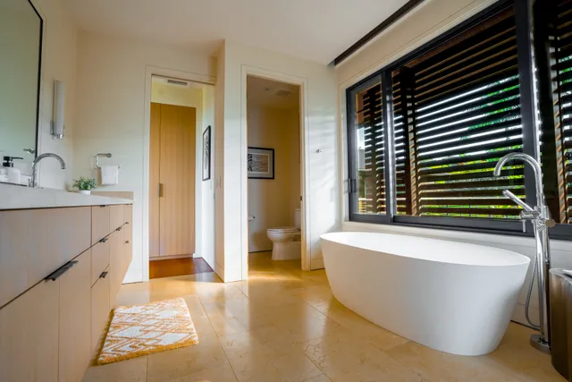 a bathroom with a bathtub and a sink