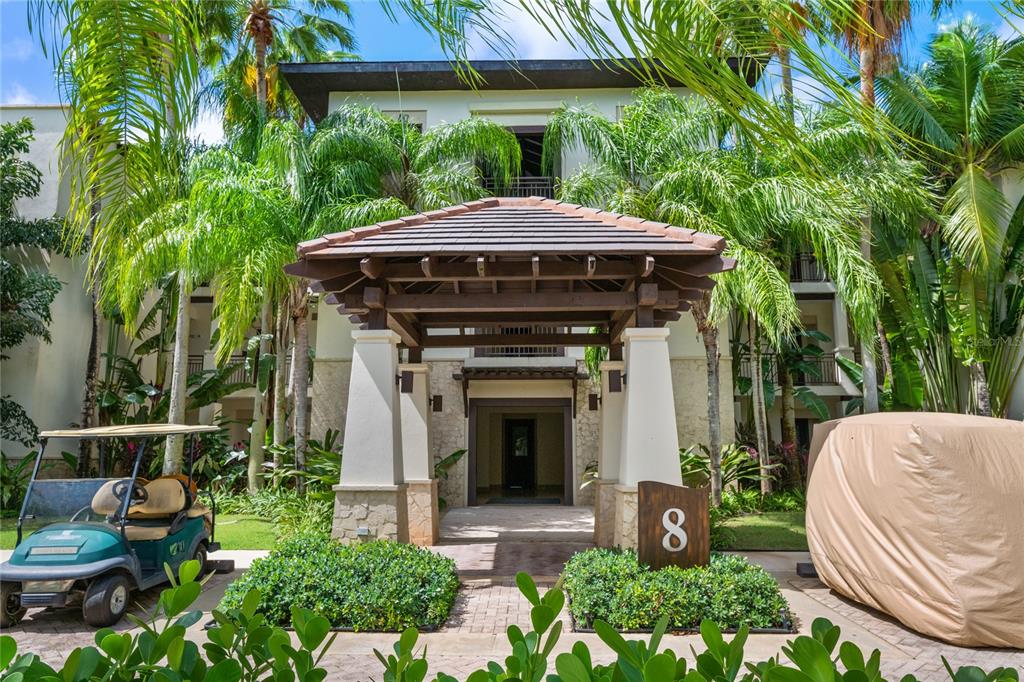 7000 Bahia Beach, Unit 8266 Rio Grande, PR 00745 - Photo 1 of 1 a front view of a house with garden