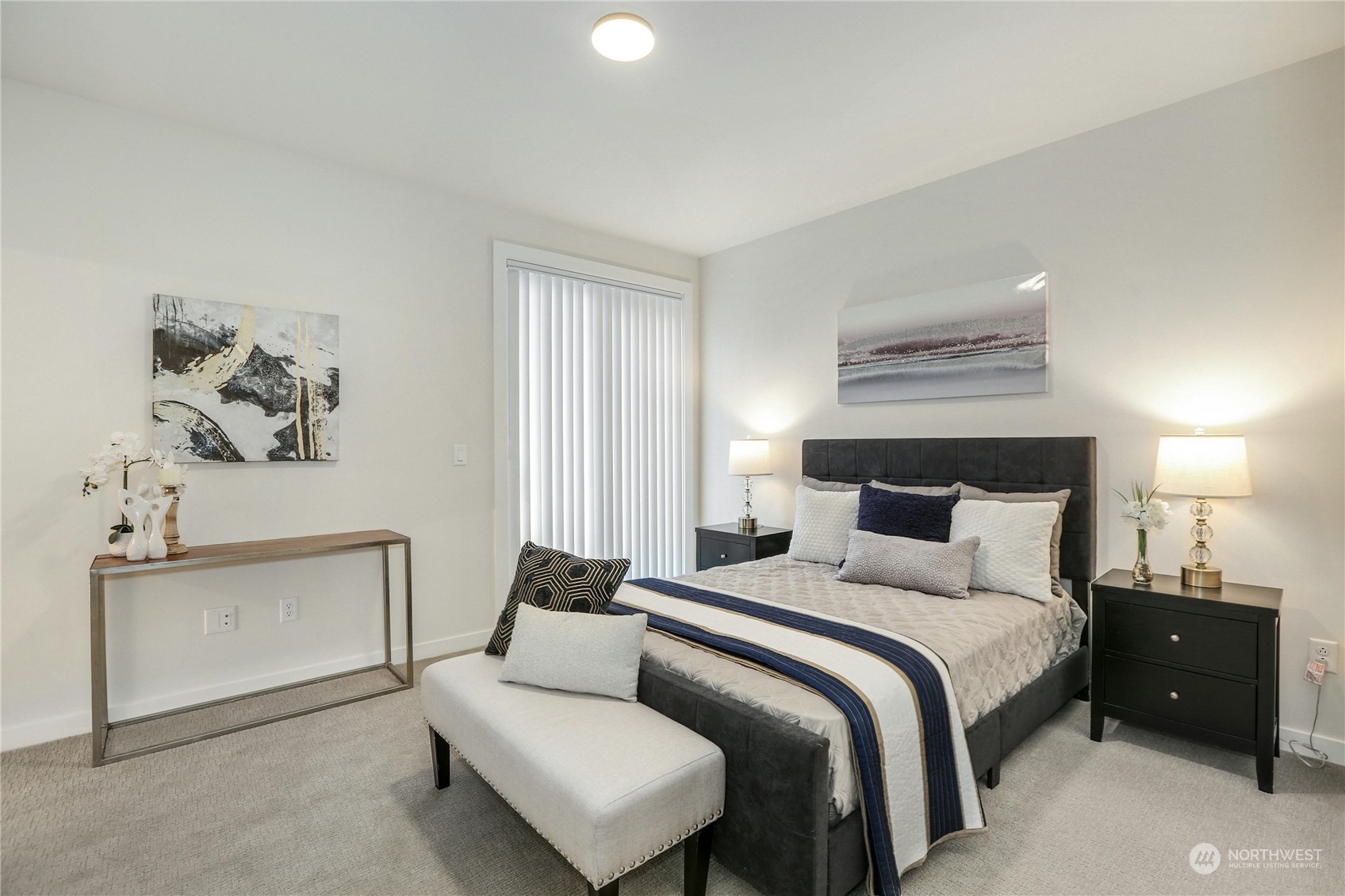 14493 Cedar Grove Road Southeast, Unit D101 Issaquah, WA 98027 - Photo 12 of 22 a bedroom with a bed and a lamp on dresser