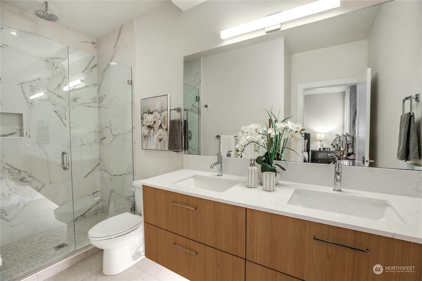 14493 Cedar Grove Road Southeast, Unit D101 Issaquah, WA 98027 - Photo 13 of 22 a bathroom with a sink toilet and shower