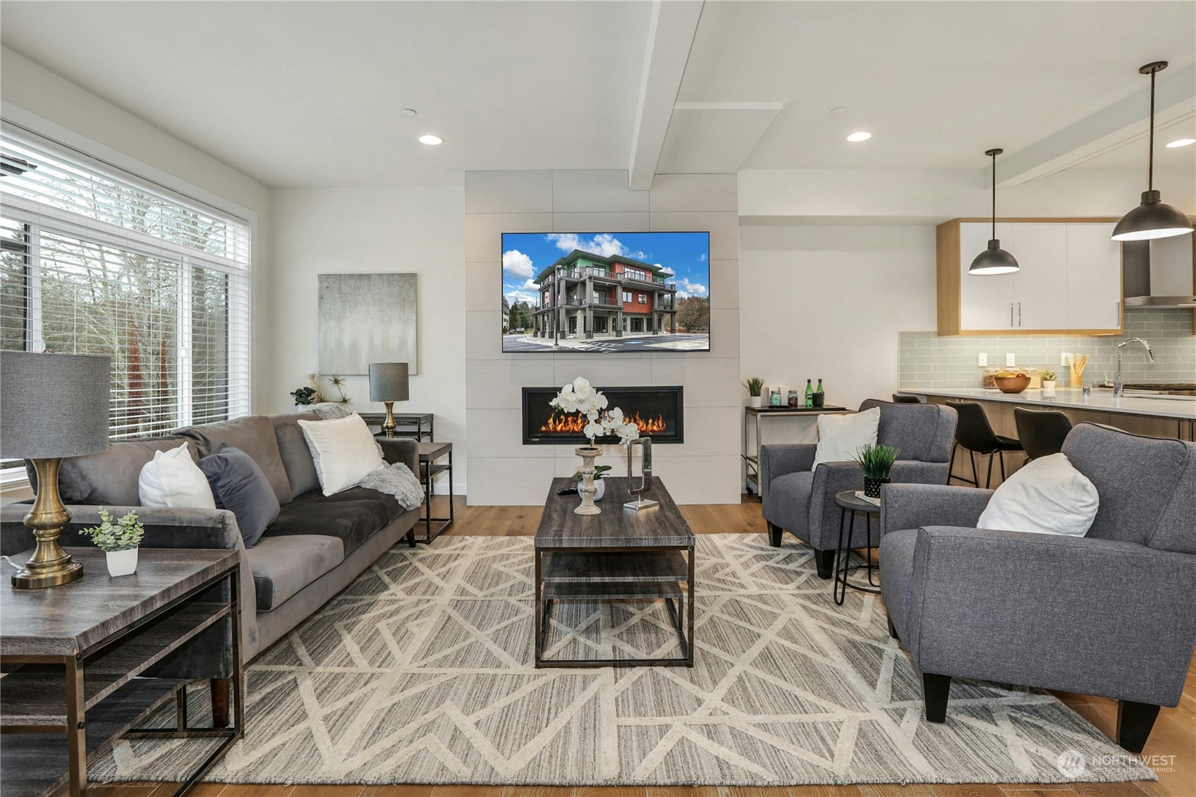 14493 Cedar Grove Road Southeast, Unit D101 Issaquah, WA 98027 - Photo 3 of 22 a living room with furniture a wooden floor and a large window