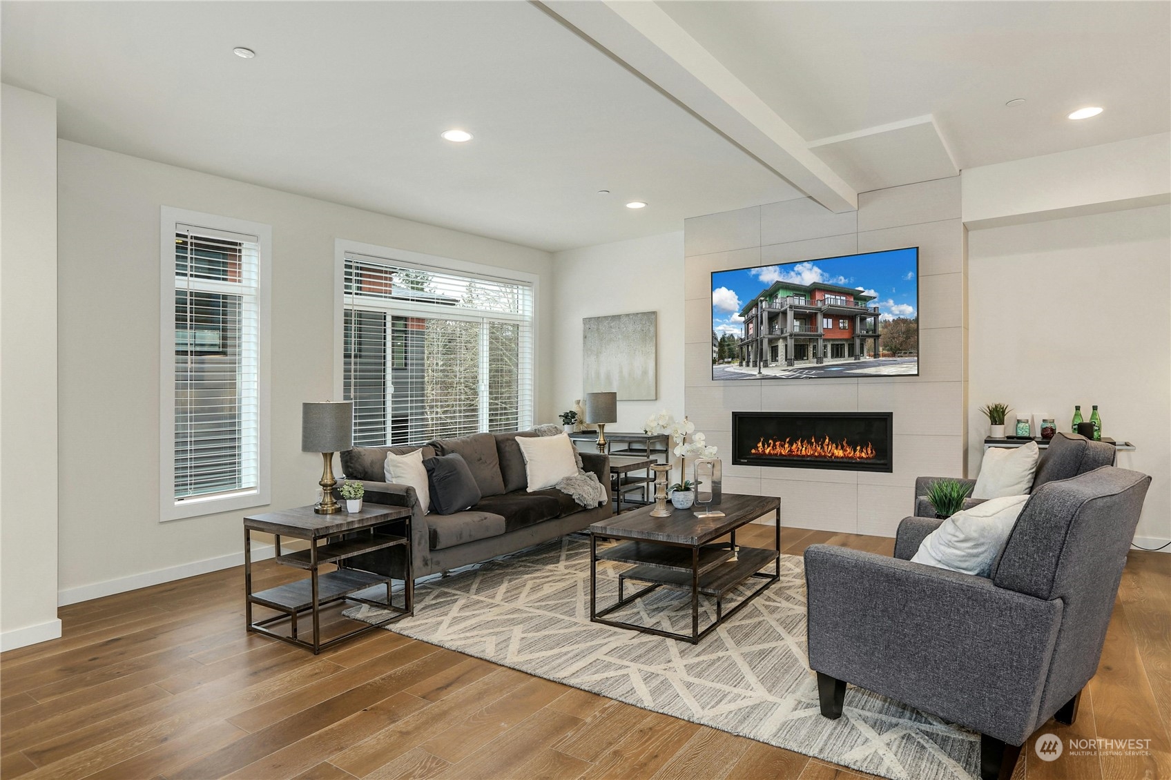 14493 Cedar Grove Road Southeast, Unit D101 Issaquah, WA 98027 - Photo 4 of 22 a living room with furniture a fireplace and a flat screen tv