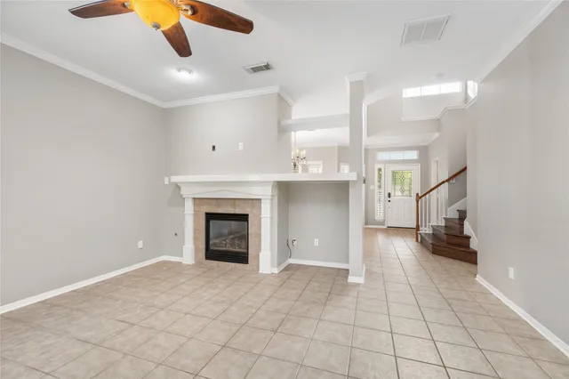 a view of an empty room and fire place