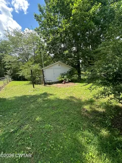 a view of an outdoor space and a yard