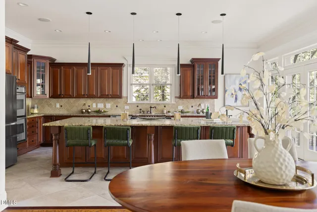 a kitchen with a sink cabinets and wooden floor