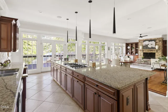a kitchen with stainless steel appliances granite countertop a sink and a counter
