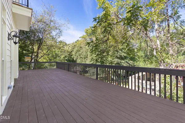 a view of balcony with wooden floor