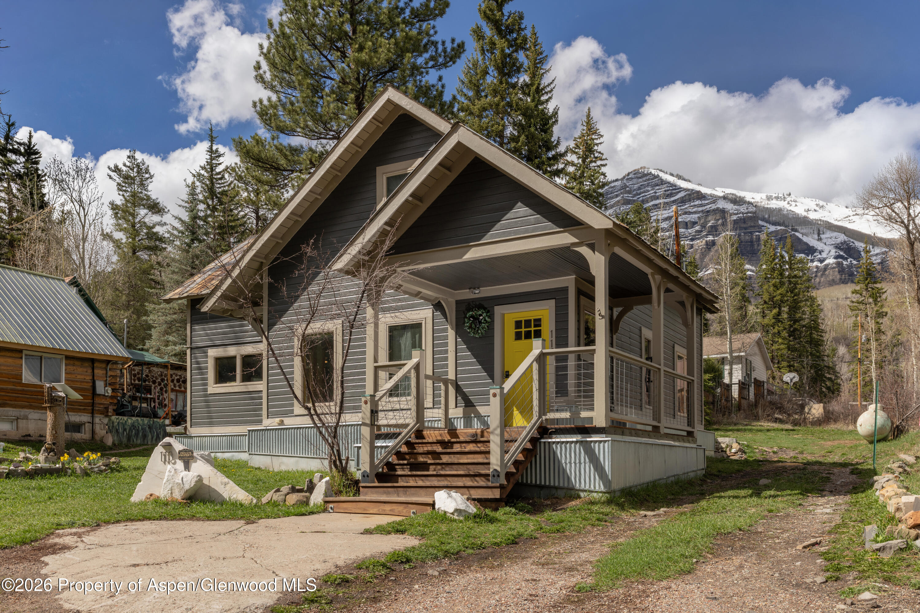 113 West State Street Marble, CO 81623 - Photo 1 of 44 a front view of a house with garden