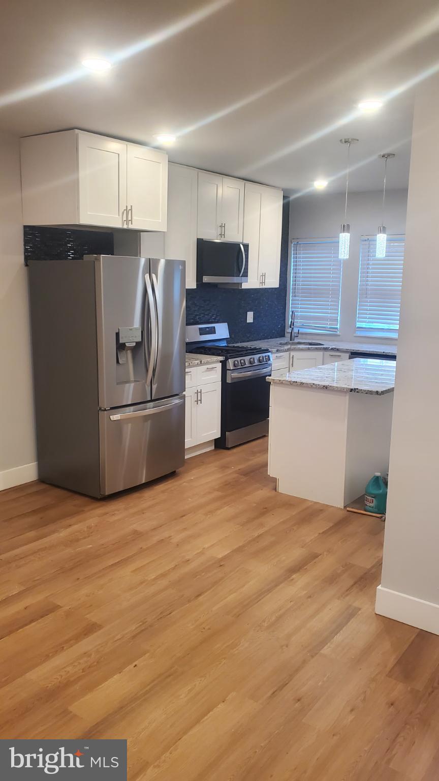 7311 North 21st Street Philadelphia, PA 19138 - Photo 5 of 15 Modern kitchen with sleek finishes.