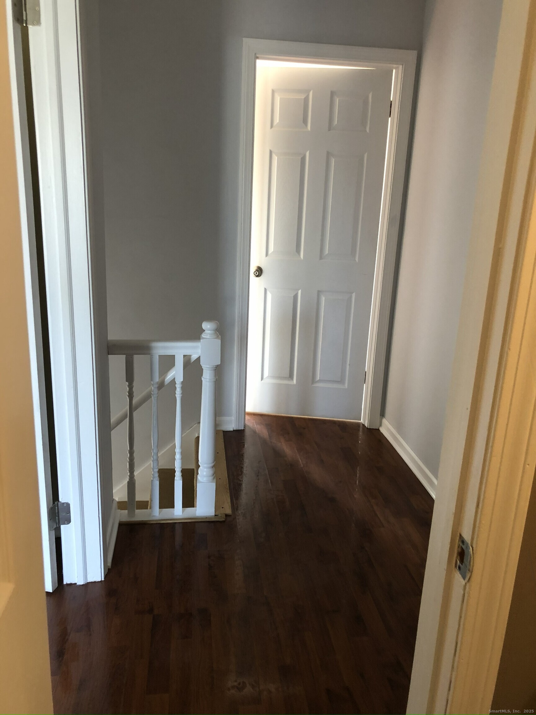 127 Black Point Road, Unit 7 East Lyme, CT 06357 - Photo 8 of 15 a view of front door with furniture and wooden floor