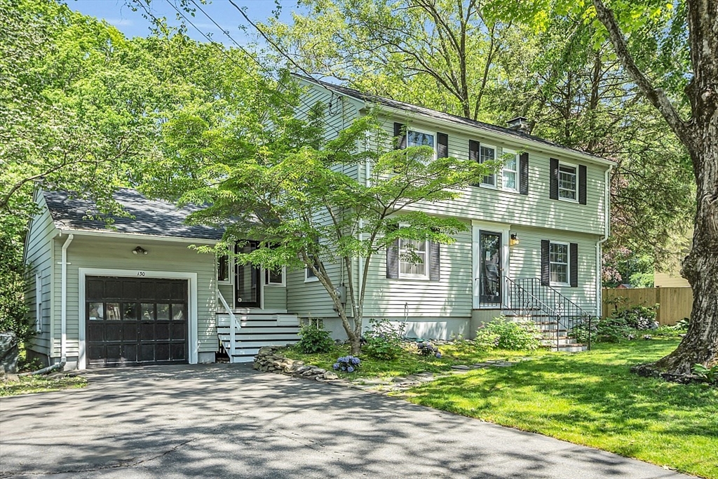 130 Adams Road Concord, MA 01742 - Photo 1 of 33 a front view of a house with a garden