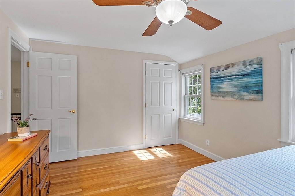 130 Adams Road Concord, MA 01742 - Photo 17 of 33 a bedroom with a bed and wooden floor