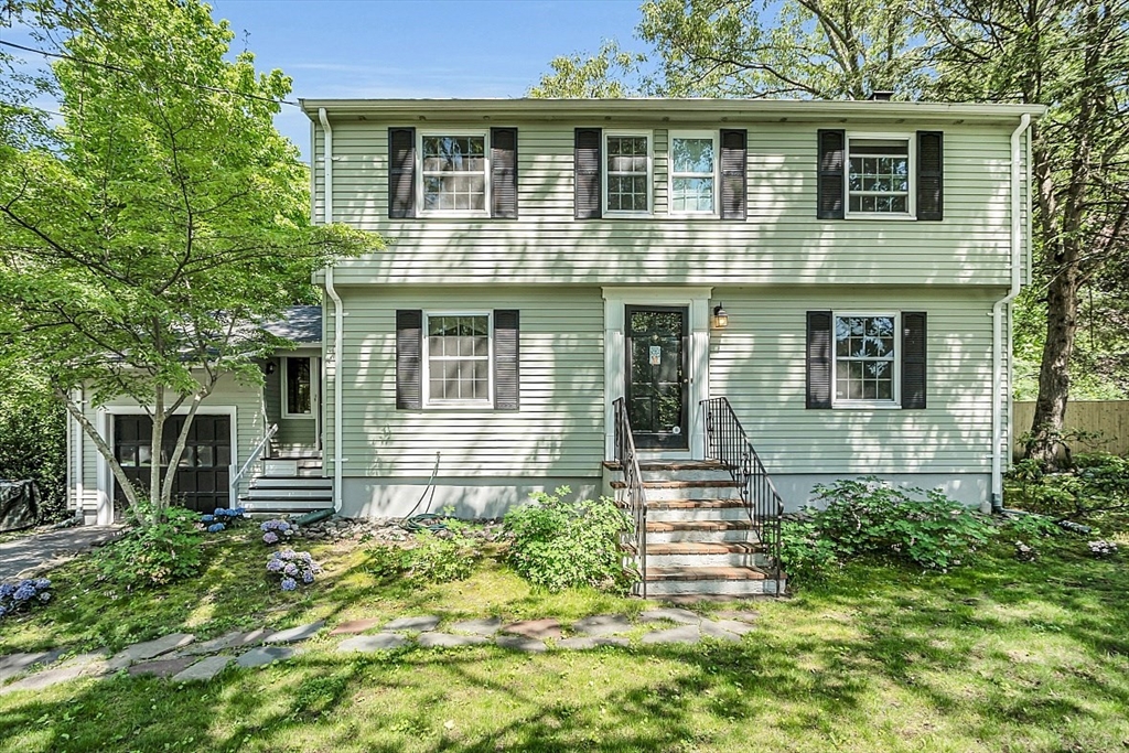 130 Adams Road Concord, MA 01742 - Photo 2 of 33 a front view of a house with a yard
