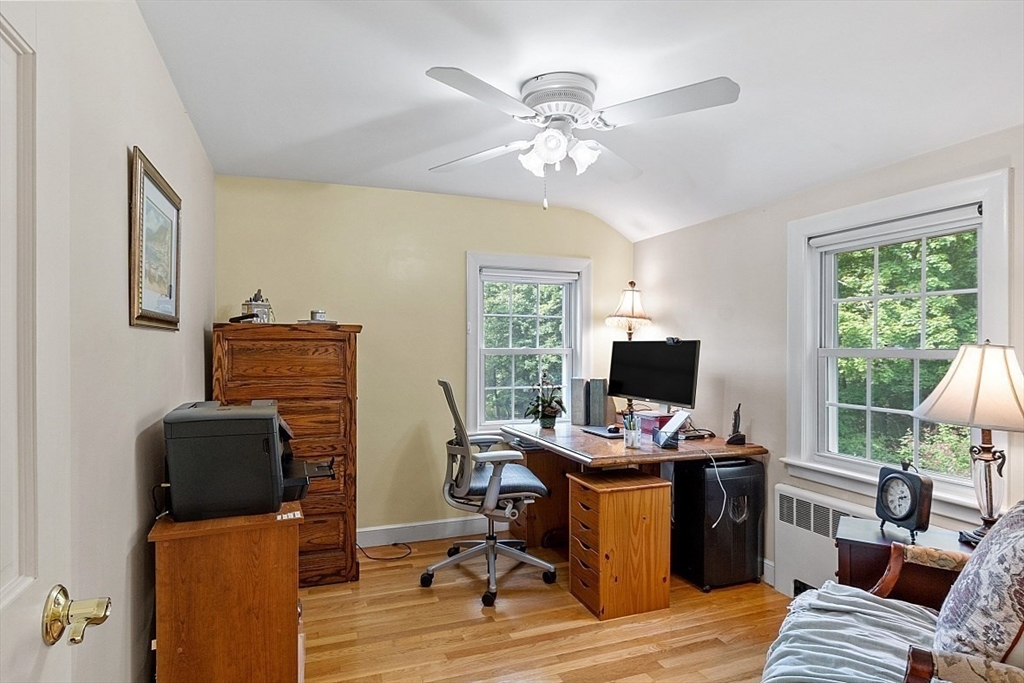 130 Adams Road Concord, MA 01742 - Photo 22 of 33 a view of a workspace with furniture and a window
