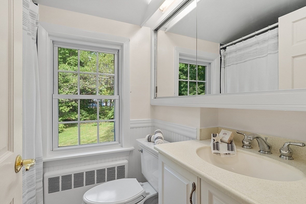 130 Adams Road Concord, MA 01742 - Photo 23 of 33 a bathroom with a sink and a toilet