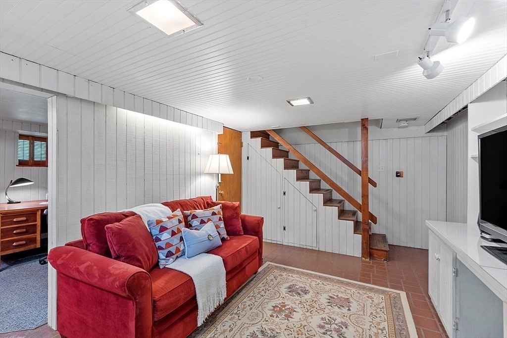 130 Adams Road Concord, MA 01742 - Photo 25 of 33 a living room with furniture and a flat screen tv