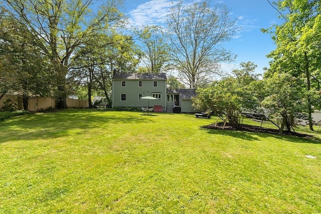 130 Adams Road Concord, MA 01742 - Photo 28 of 33 a swimming pool with trees in front of it