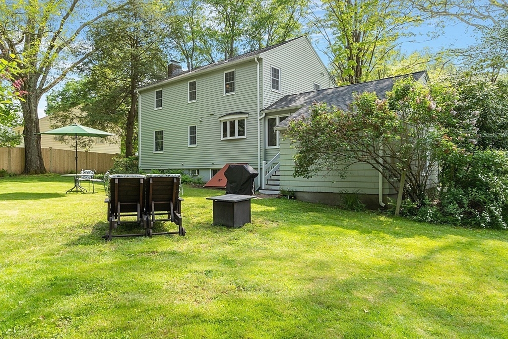 130 Adams Road Concord, MA 01742 - Photo 29 of 33 a backyard of a house with table and chairs