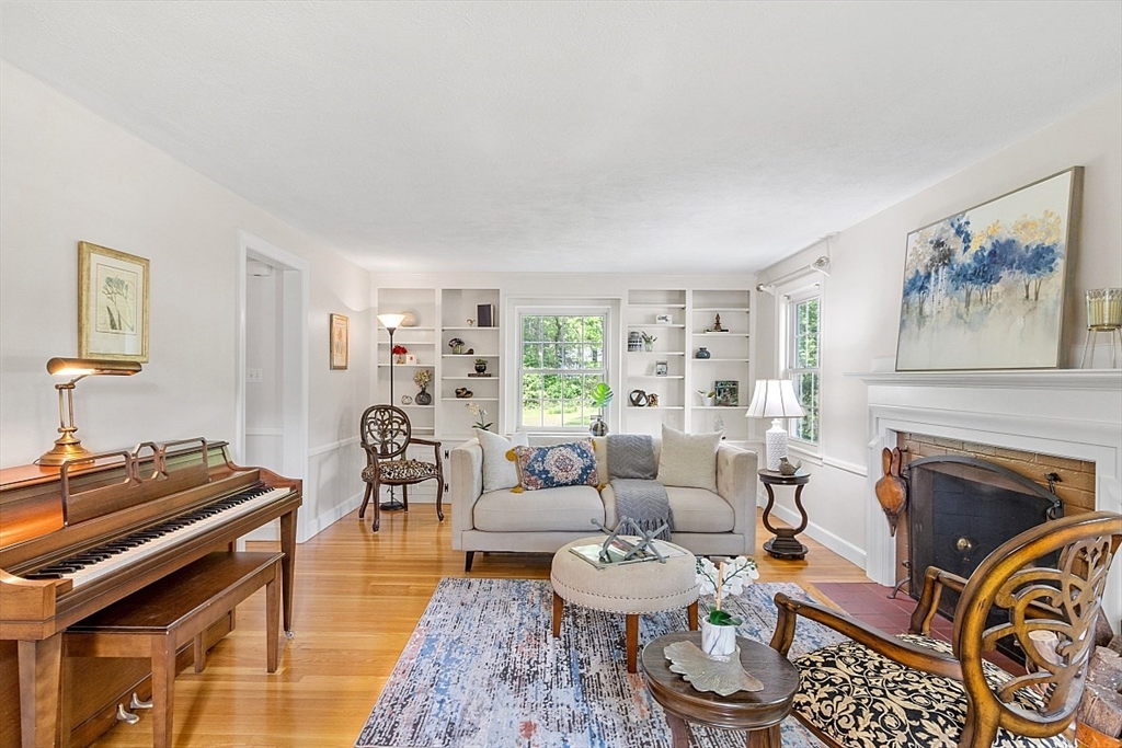 130 Adams Road Concord, MA 01742 - Photo 6 of 33 a living room with furniture and a fireplace