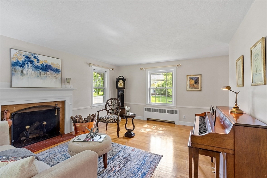130 Adams Road Concord, MA 01742 - Photo 7 of 33 a living room with furniture and a fireplace