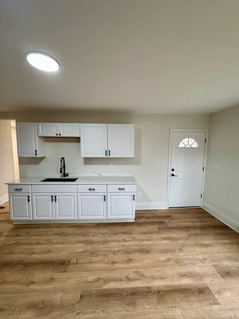 a bathroom with a toilet sink and shower