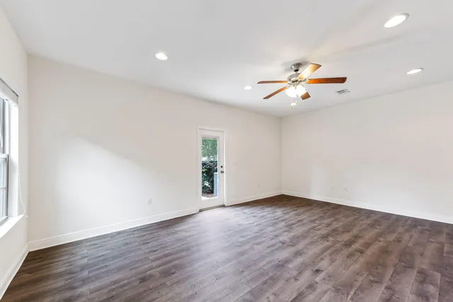 a view of kitchen with wooden floor and a sink