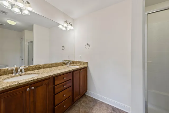 a bathroom with a shower and a toilet