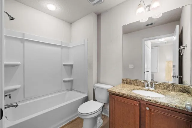 a view of a swimming pool with a garden and plants