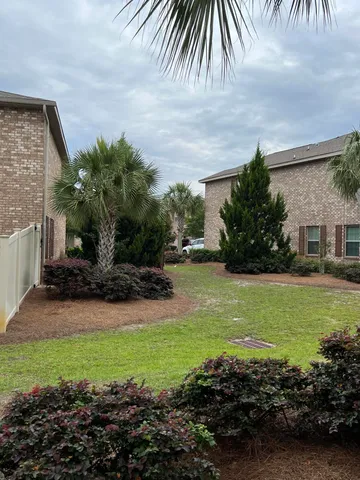 a view of a swimming pool with a yard