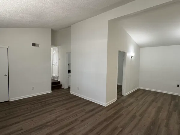 an empty room with wooden floor