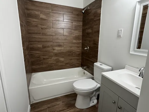 a bathroom with a toilet and a bathtub
