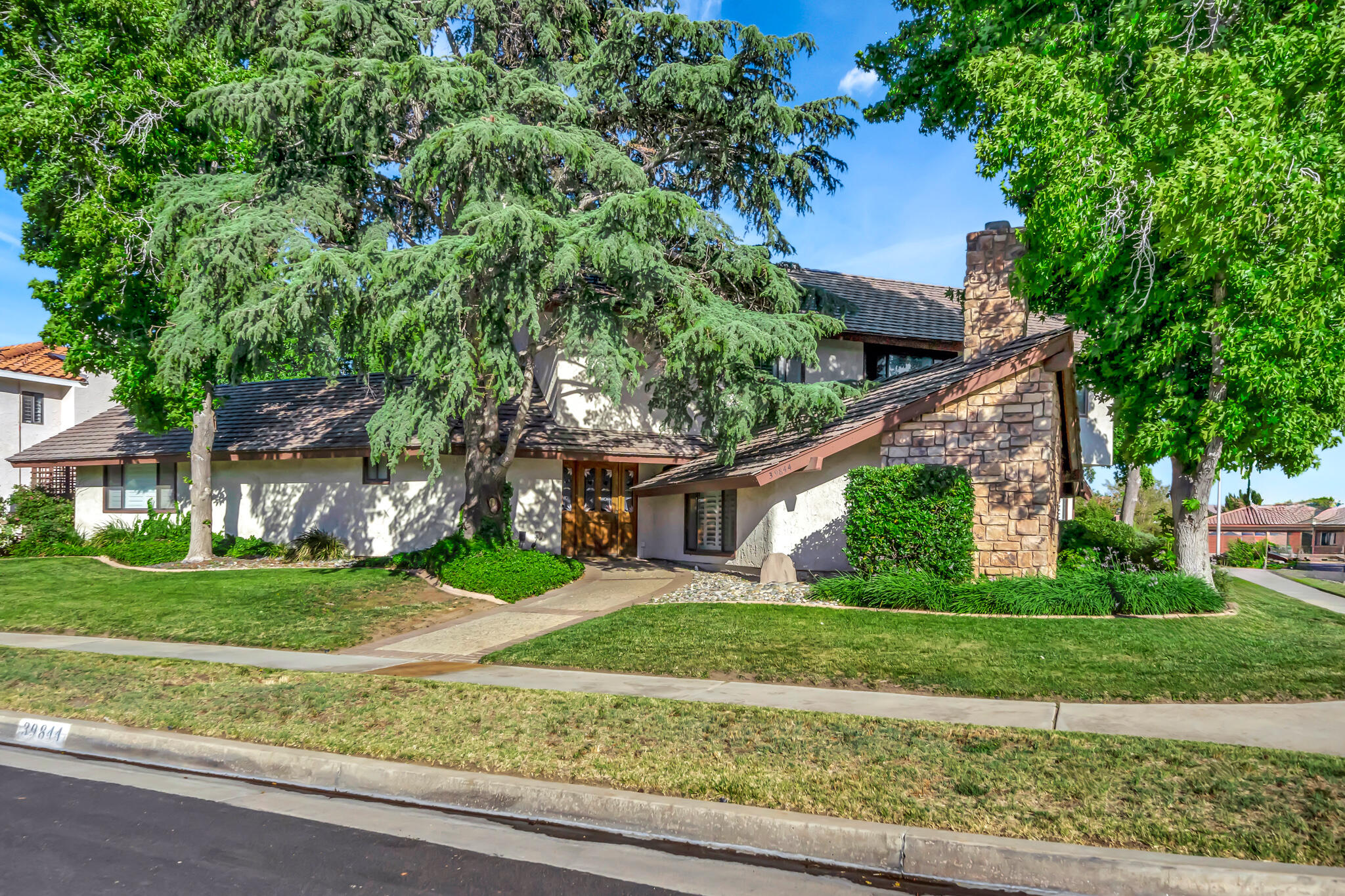 front view of a house with a yard