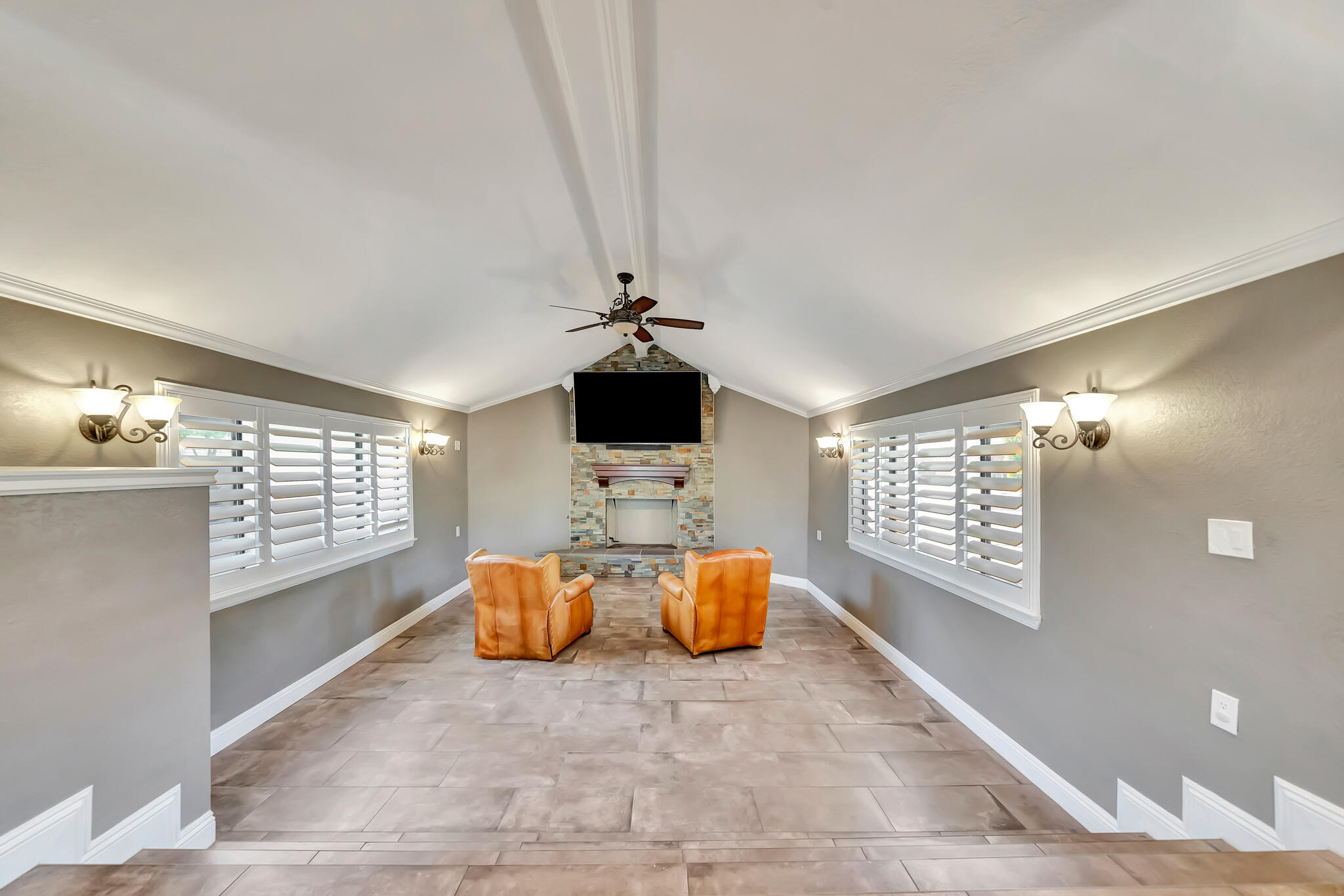 39844 Golfers Drive Palmdale, CA 93551 - Photo 19 of 87 a living room with furniture a chandelier and a flat screen tv