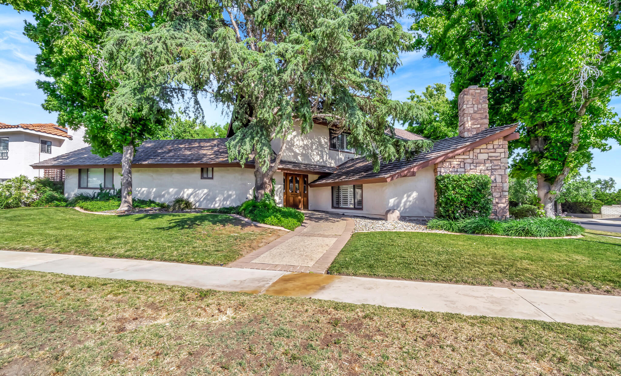 39844 Golfers Drive Palmdale, CA 93551 - Photo 2 of 87 a front view of a house with a yard