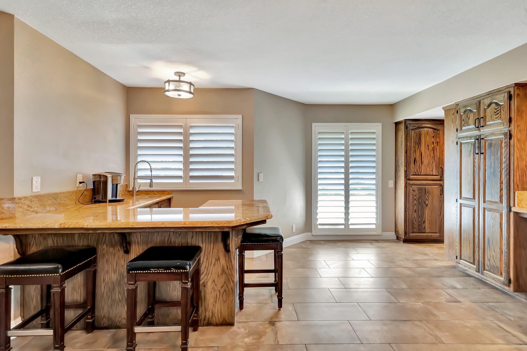 39844 Golfers Drive Palmdale, CA 93551 - Photo 27 of 87 a view of a workspace with furniture and a window