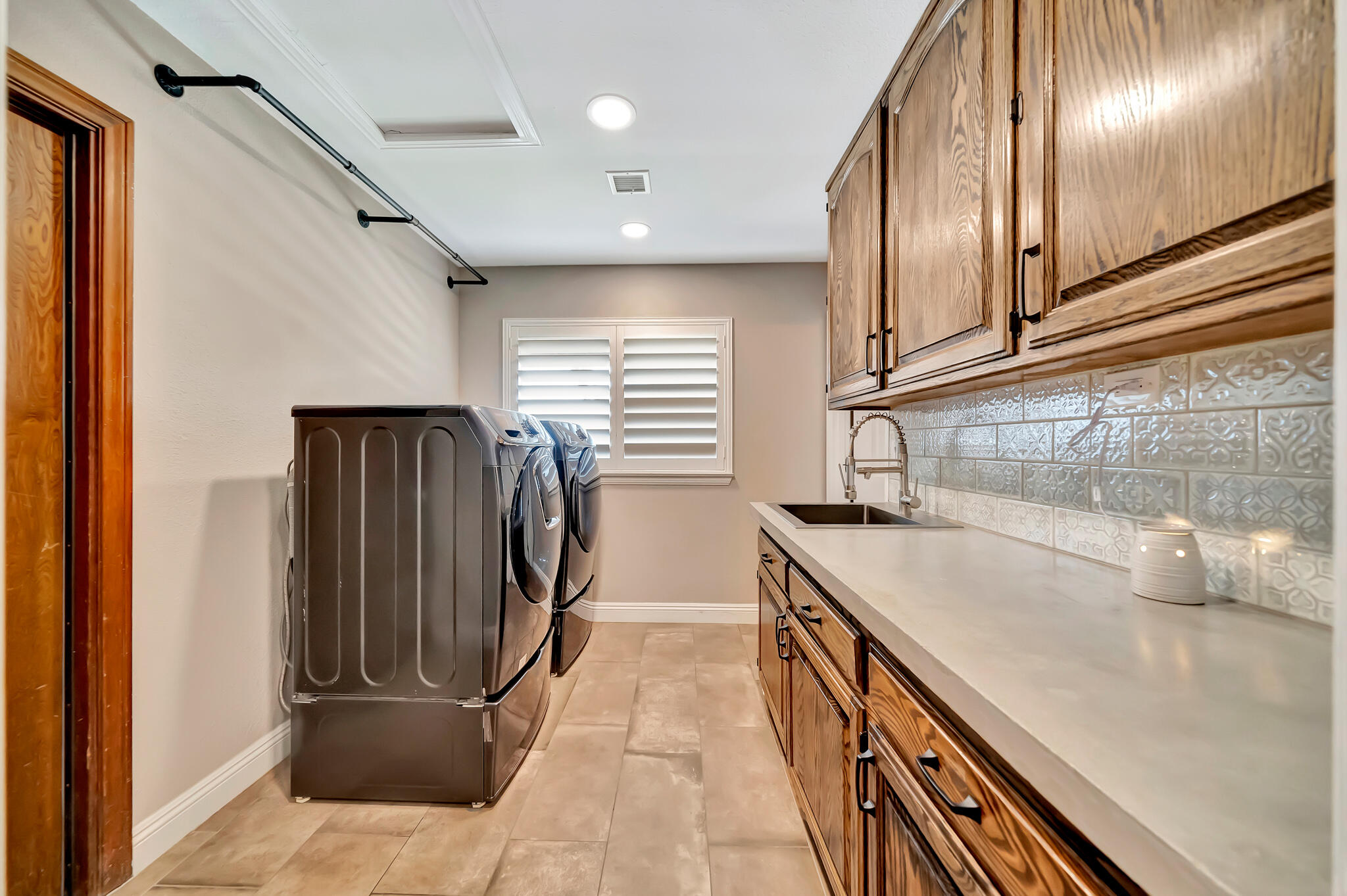 39844 Golfers Drive Palmdale, CA 93551 - Photo 30 of 87 a kitchen with stainless steel appliances granite countertop a sink and a refrigerator
