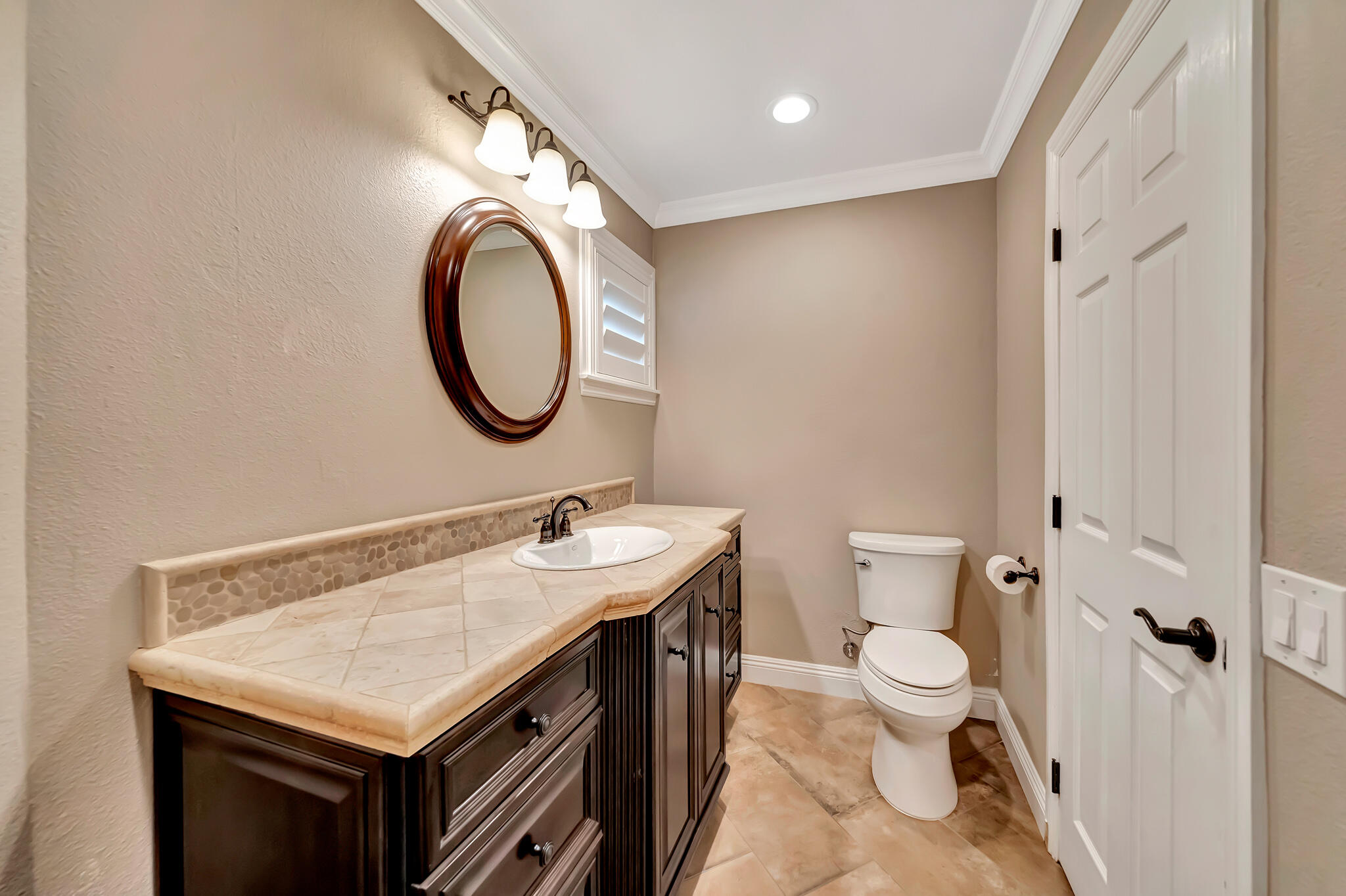 39844 Golfers Drive Palmdale, CA 93551 - Photo 36 of 87 a bathroom with a toilet a sink a mirror and a shower