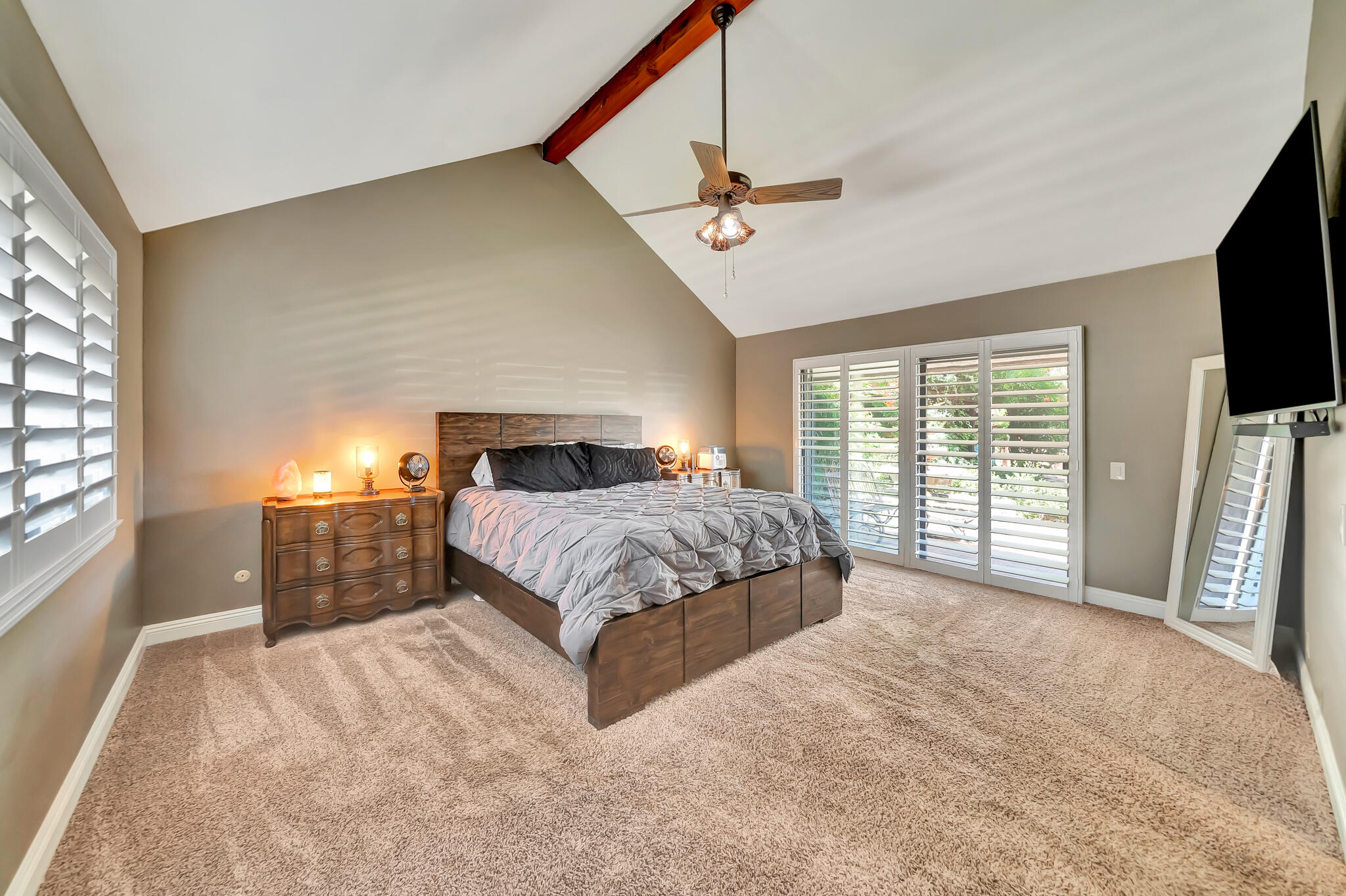 39844 Golfers Drive Palmdale, CA 93551 - Photo 38 of 87 a bedroom with a large bed and a flat tv screen on dresser