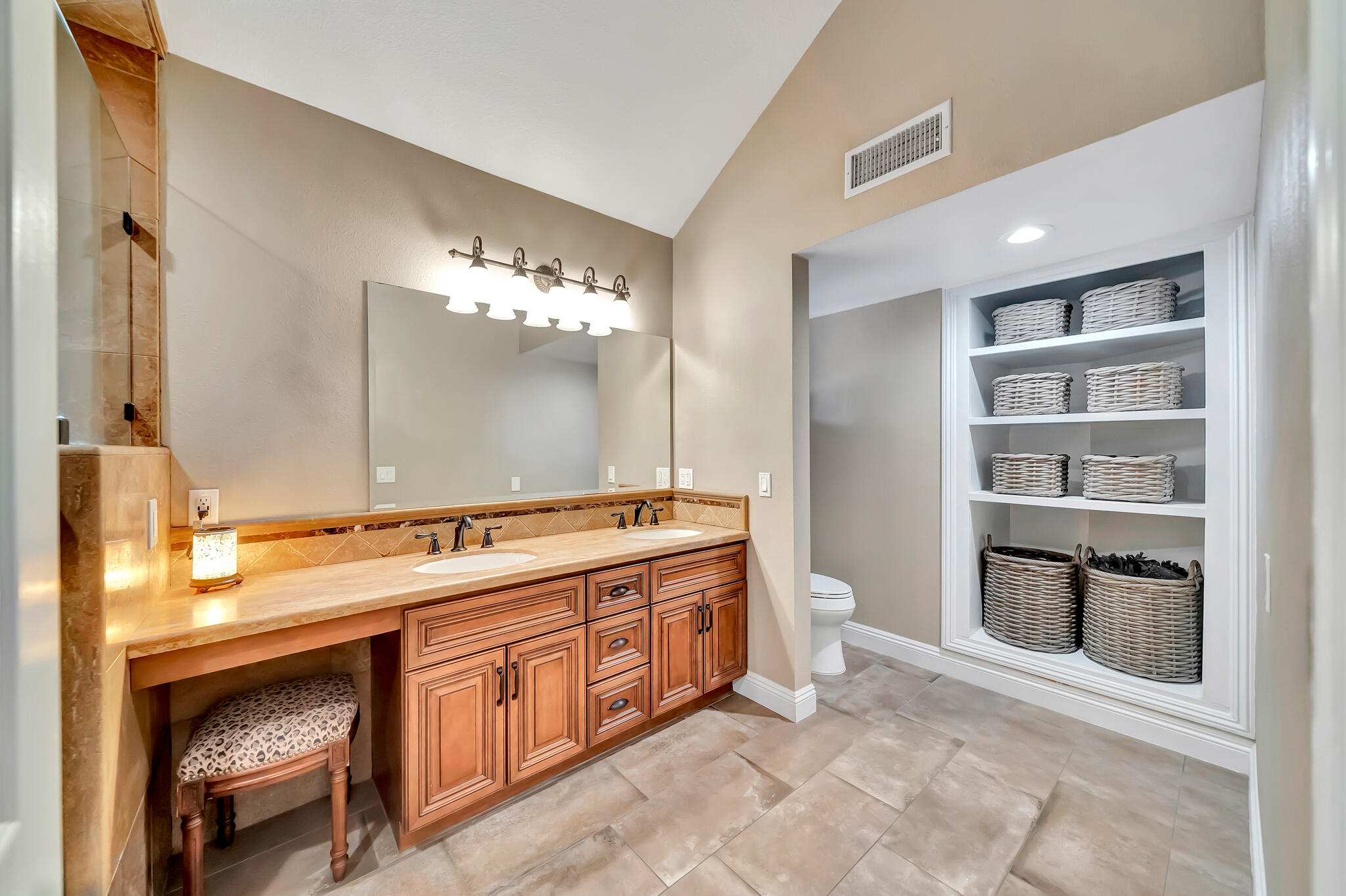 39844 Golfers Drive Palmdale, CA 93551 - Photo 41 of 87 a spacious bathroom with a granite countertop sink a toilet and a mirror