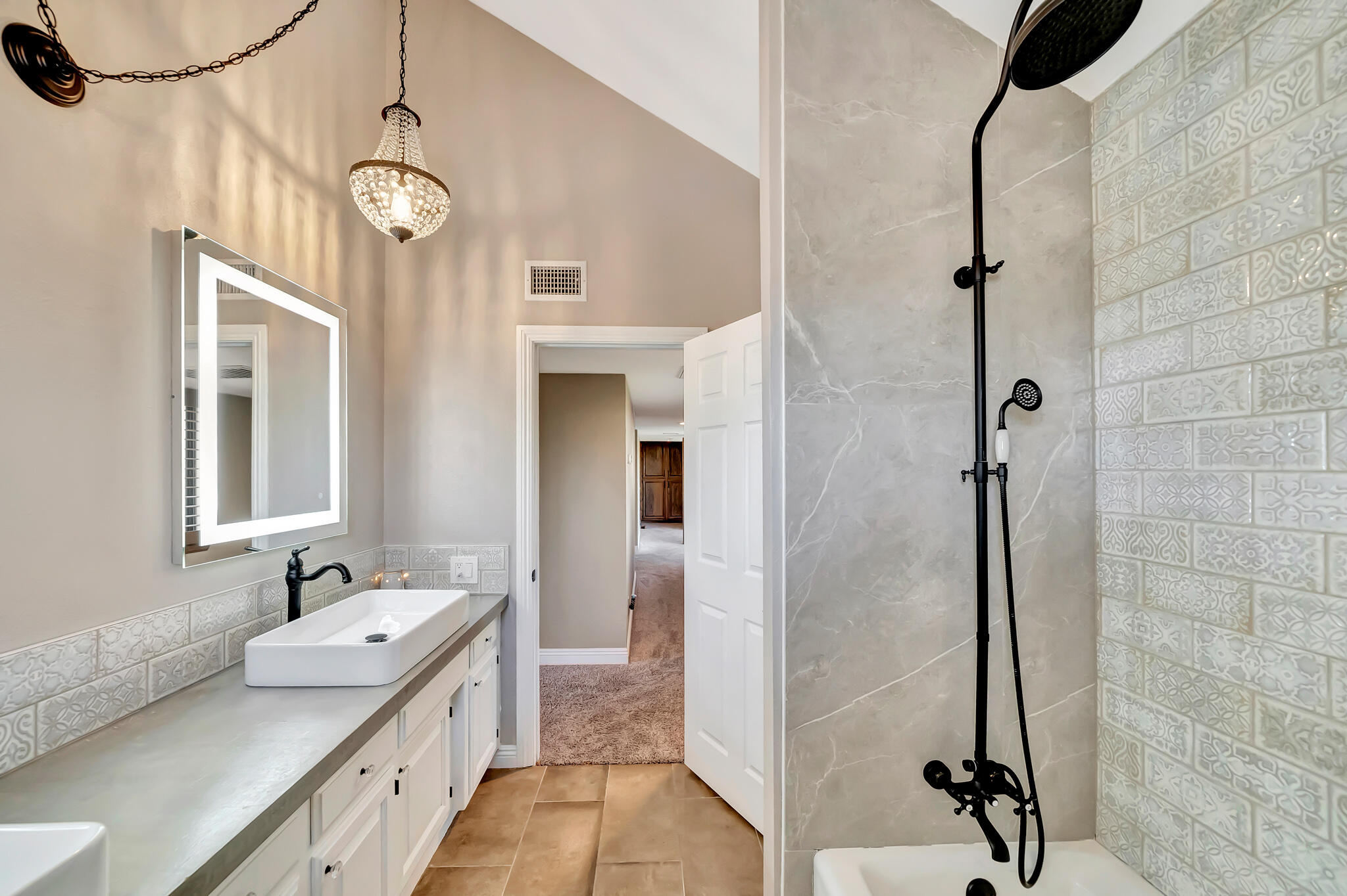 39844 Golfers Drive Palmdale, CA 93551 - Photo 52 of 87 a bathroom with a granite countertop sink a mirror and shower